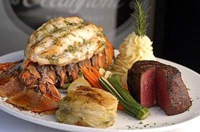 Enjoy the Oceanic atmosphere at a steakhouse with lobster and vegetables.