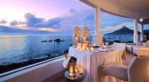 A high-ranking South African hotel with a balcony overlooking the ocean.
