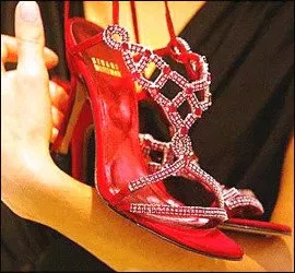 A woman flaunting a pair of costly stilettos.