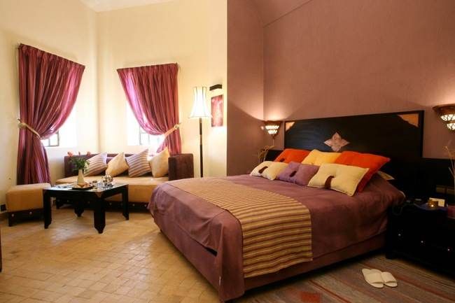 A luxurious bed in a room at Sahara Hotel.