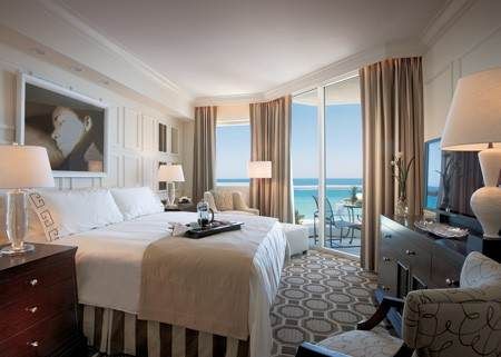 A hotel room with a view of the ocean at Acqualina Resort & Spa, adorned with coral ornament.