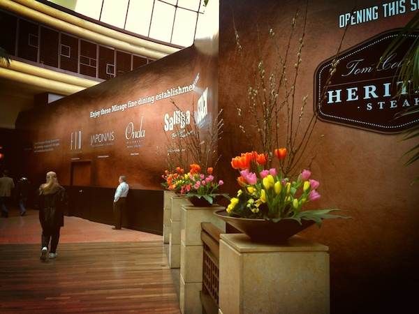 Tom Colicchio's Heritage Steak is a Las Vegas restaurant with flowers and a sign that says Herbert's Steakhouse.