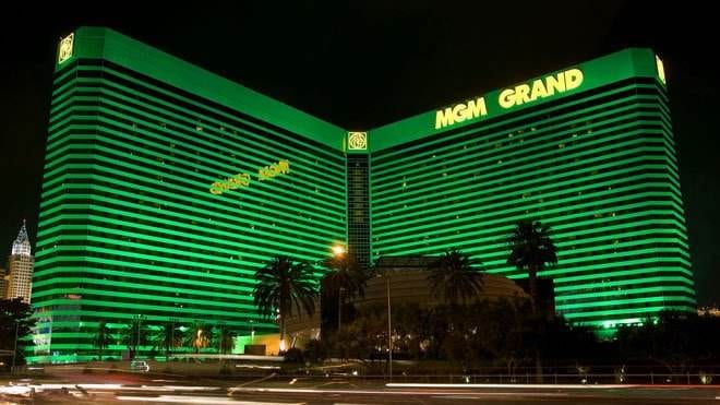 The MGM Grand hotel and casino in Las Vegas is lit up in green, offering VIP treatment.