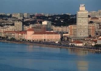 An aerial view of Luanda with a river in the background.
