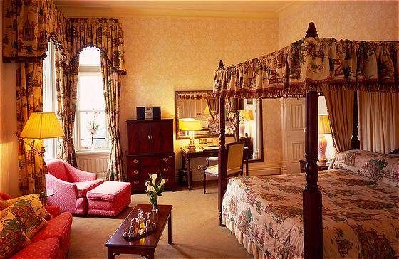Slip into the fairytale Ashford Castle to breathe the ancient essence of a room with beds.