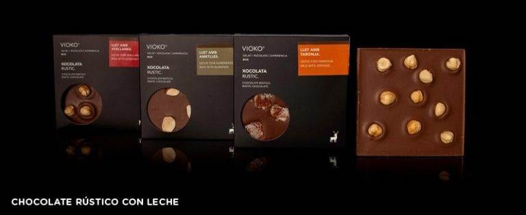 Four chocolate bars with nuts on them at Vioko in Barcelona - the Best Chocolate & Gelato.
