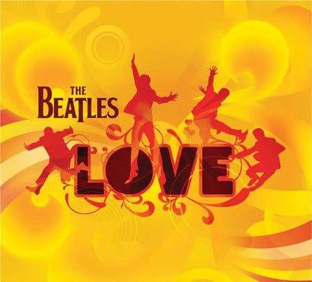 The Beatles LOVE logo on a vibrant yellow background at the one and only Vegas show.