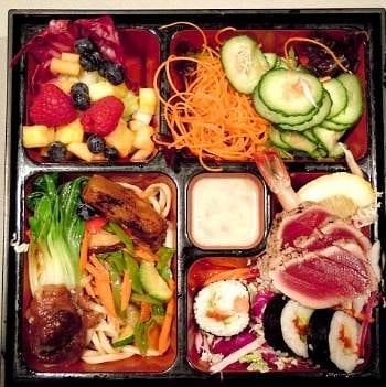 A bento box with various food options.