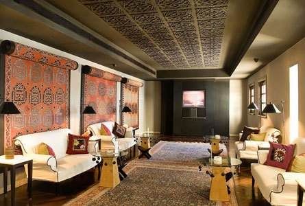 An ornately decorated living room with couches and chairs, featuring The Marmara Bodrum.