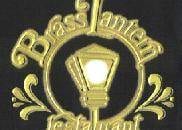 The brass lantern logo on a black shirt featuring the Brass Lantern Restaurant.