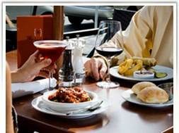 A couple enjoying a meal at Burton's Grill in Boston, Massachusetts.