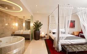 A boutique hotel in Russia with a large bed and a bathtub.