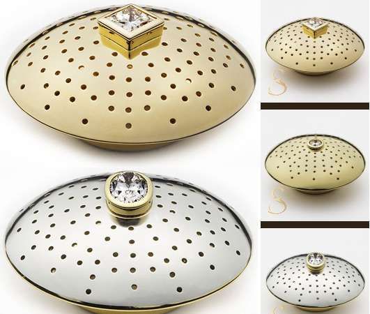 A gold and silver dish with a diamond in the middle, resembling a Chapeau de Vin wine closure.