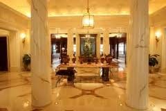 A luxurious lobby with columns and a marble floor at Caesar's Palace in Las Vegas.
