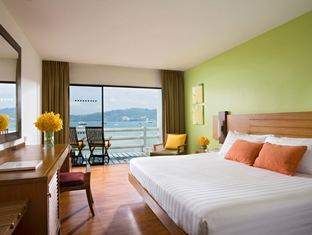 A hotel room with a view of the ocean at Coral Beach & Tennis Club.