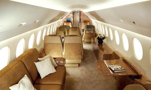 The luxury interior of a Dassault Falcon 7X private jet.