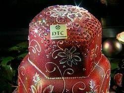 A red cake decorated with diamonds.