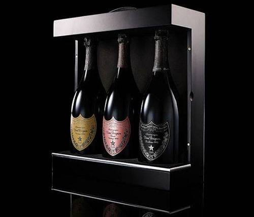 Three bottles of vintage champagne in a black box.