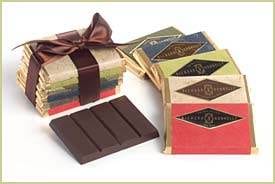 Indulge in the finest chocolates as they melt in your mouth, presented with a charming bow.