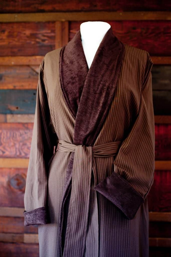 A brown striped robe on a wooden mannequin sold by Telegraph Hill Luxury Robes.