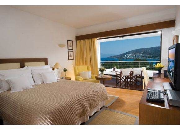 A room with a view of the ocean at Elounda Beach Hotel.