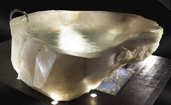 Keywords: Style, Luxury

Revised description: A luxurious bathtub carved from a large piece of rock.