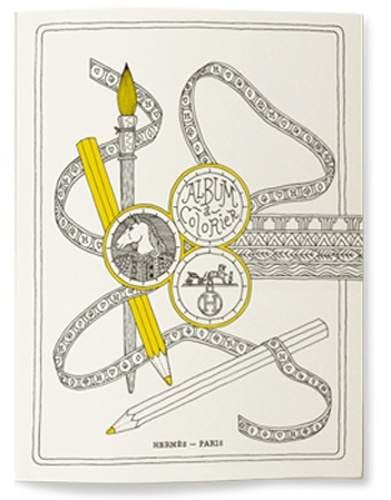 A luxury coloring book featuring pencils and a yellow ribbon for a thrilling experience.