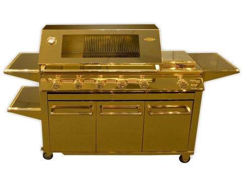 A gold bbq grill on wheels perfect for a spectacular summer holiday.