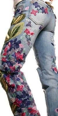 A woman wearing floral jeans.