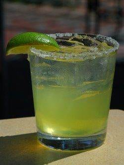 A lime margarita at Johnny Utah's with a lime wedge on top.