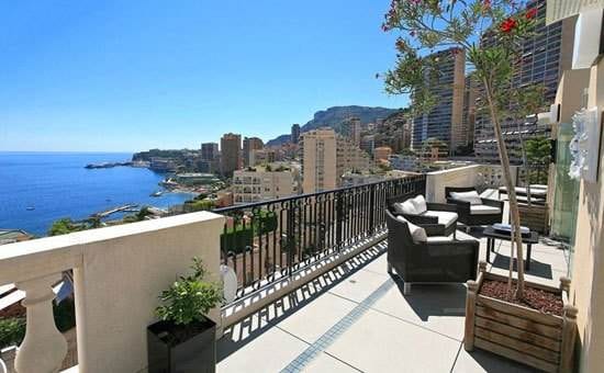 A Monte Carlo dream home with a balcony overlooking the ocean.