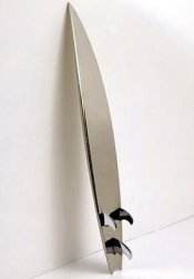 Designer surfboard on white wall.