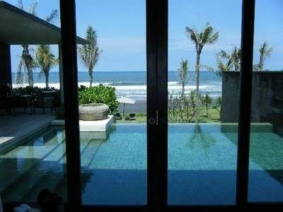 Ten Bedroom Residence with an ocean view from a glass door.