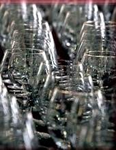 A row of wine glasses on a table, too thin and perfect for sipping Pinot in the rich city of San Francisco.