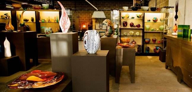 A shop with a lot of vases on display.