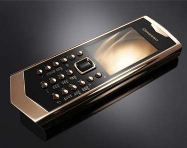 A gold and black cell phone from the Avantgadre Collection.