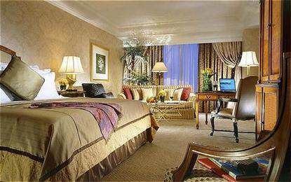 Hotel Mulia Senayan offers spacious accommodations with a comfortable bed and workspace.