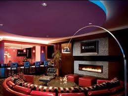 A living room with red couches and a fireplace, perfect for celebrating in style!