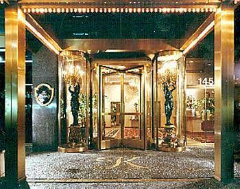 A hotel entrance at night, perfect for a girlfriend getaway in NYC.