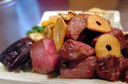 A plate of Kobe steak and vegetables on a table at Renga-tei restaurant.