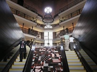 A man walks up the stairs of The Liberty Hotel in Boston, Massachusetts.