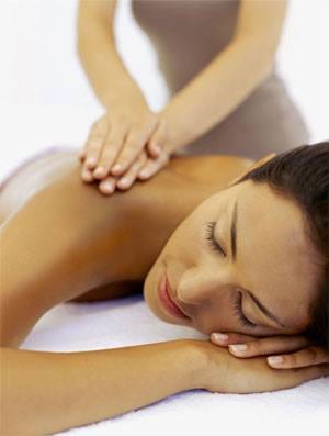 A woman receiving a massage at a spa in NYC.