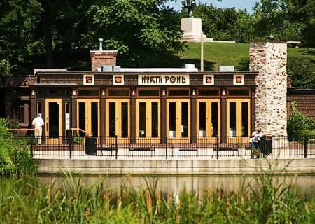 A building with a pond in front of it in Chicago.
