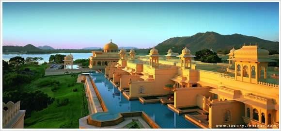 Experience the Indian Palatial Style at The Oberoi Udaivilas palace nestled amidst breathtaking mountains and a serene lake.
