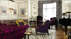A living room with zebra print furniture and a piano at the heart of London.