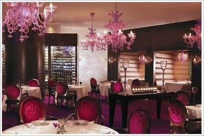 A restaurant with purple chairs and chandeliers: Reflets par Pierre Gagnaire.