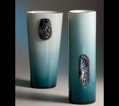 Two vases with stunning blue and black designs on them at Pilchuck's gala glass auction.