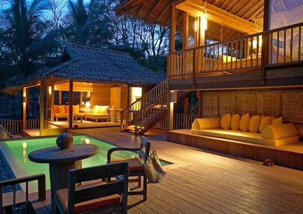 A wooden house at night.