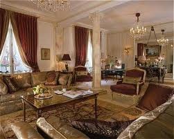 A Presidential Suite at The Plaza in New York, with ornate furniture and a chandelier, where dreams merge with reality.