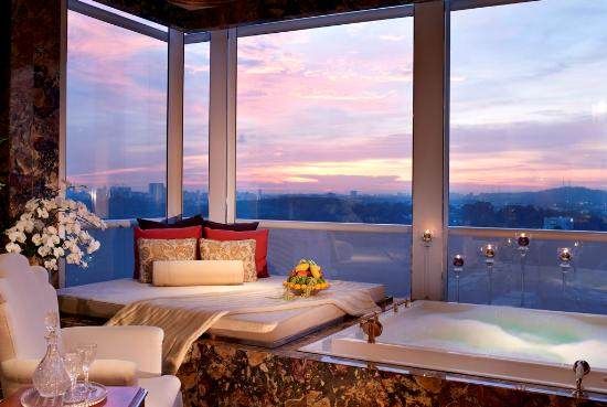 A bathroom with a jacuzzi tub in the St. Regis hotel in Singapore..